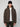 A person wearing a black beanie, white t-shirt, dark pants, and the PROJEK RAW MENS PUFFER JACKET WITH HOOD in dark brown stands against a plain light background, looking directly at the camera.