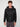 A young man with short curly hair wears the PROJEK RAW MENS MOTO JACKET WITH REMOVABLE HOODED DICKIE over a black shirt and zip-up hoodie, standing facing forward against a plain light gray background with a neutral expression.
