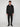 A man stands facing forward against a plain light background, wearing the PROJEK RAW MENS BONDED MICRO SUEDE JACKET in black, paired with black pants, black boots, and a white t-shirt underneath.