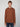 A person with short light brown hair wears the PROJEK RAW MENS HOODED LONG SLEEVE KNIT and blue jeans, standing against a plain light gray background, facing forward with a neutral expression for casual comfort.