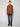 A person stands against a plain light gray background, wearing the PROJEK RAW MENS HOODED LONG SLEEVE KNIT with blue jeans and black shoes, facing forward with arms relaxed at their sides.