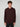A young man with curly brown hair wears the PROJEK RAW MENS HOODED LONG SLEEVE KNIT in dark maroon and black pants, standing against a light gray background and facing forward with a neutral expression.