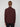 A person with short light brown hair faces away from the camera, wearing a PROJEK RAW MENS 1/4-ZIP CASHMERE TOUCH SWEATER in dark maroon and black pants, set against a plain light gray background.