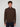 A young man faces the camera wearing a PROJEK RAW MENS ZIP-UP CASHMERE TOUCH SWEATER with a high collar and dark pants, set against a plain light gray background.
