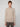 A man with short light brown hair wears a PROJEK RAW MENS CREW NECK CASHMERE TOUCH SWEATER in beige and brown plaid pants, standing against a plain light gray background, facing forward with a neutral expression.