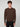 A young man with curly brown hair wears the PROJEK RAW MENS CREW NECK CASHMERE TOUCH SWEATER and black pants, standing against a plain light gray background and looking directly at the camera with a neutral expression.