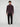 A young man stands facing forward in a PROJEK RAW MENS CHENILLE MOCK NECK SWEATER, paired with black pants and white sneakers, against a plain light gray background.