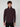 A young man with curly brown hair wears a PROJEK RAW MENS CHENILLE MOCK NECK SWEATER in dark maroon and black pants, standing against a plain light gray background, looking straight ahead with a neutral expression.