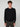 A young man with curly brown hair stands facing forward, wearing a PROJEK RAW MENS SHAKER RIB KNIT SWEATER and dark pants against a plain light gray background.