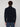 Shown from the back, a person with short, curly brown hair wears the PROJEK RAW MENS CHENILLE MOCK NECK SWEATER in dark navy with blue cargo pants against a plain light gray background.