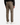 A person is shown from the back, standing against a plain white background, wearing PROJEK RAW SOLID BUNGEE RELAXED FIT CARGO PANT in taupe stretch fabric for men, paired with a black shirt and white sneakers.