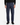 A person wearing PROJEK RAW’s SOLID BUNGEE LOOSE FIT CARGO PANT for men in navy blue with utility pockets, paired with a black sweater, black shoes, and a watch, stands facing forward against a plain white background.