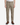 A person wearing PROJEK RAW’s SOLID BUNGEE LOOSE FIT CARGO PANT for men, which features utility pockets, along with a white shirt and brown boots, stands facing forward with arms at their sides against a plain white background.