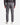 A person is standing with their back to the camera against a plain light background, wearing PROJEK RAW SOLID BUNGEE 5-POCKET RELAXED FIT PANTS in gray, paired with a ribbed dark sweater and white sneakers.