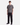 A person stands facing forward, wearing a gray, marble-patterned short-sleeve shirt—an unmistakable modern essential—paired with PROJEK RAW SOLID BUNGEE 5-POCKET RELAXED FIT PANTS in black and matching black shoes, set against a plain white background.