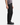 A person stands against a plain white background, wearing the PROJEK RAW SOLID BUNGEE 5-POCKET RELAXED FIT PANTS. Only the lower half of their body is visible, highlighting these modern essentials. The pants are paired with a gray patterned shirt and black shoes.
