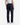 A person wearing a white tank top, PROJEK RAW CAVALRY TWILL BUNGEE RELAXED FIT CHINO PANTS in navy blue, and white sneakers stands facing away, highlighting the back view of the pants.