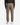 A person is shown from the back wearing the PROJEK RAW MEN’S SOLID BUNGEE RELAXED FIT CARGO JOGGER in taupe, featuring elastic cuffs, side and back pockets. The utility-inspired jogger pants are paired with white sneakers and a dark sweater.