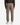 A person is shown from the back against a plain white background wearing PROJEK RAW’s SOLID BUNGEE RELAXED FIT CARGO JOGGER in light brown, paired with a dark sweater and white sneakers.