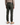A person stands facing away, wearing a beige sweater, tan boots, and the PROJEK RAW CANVAS BUNGEE CLASSIC FIT 5-POCKET PANTS in dark green. The pants feature classic 5-pocket styling, visible belt loops, and back pockets. The background is plain white.