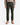 A person wearing PROJEK RAW’s CANVAS BUNGEE CLASSIC FIT 5-POCKET PANTS in olive green, styled with a beige long-sleeve shirt and tan lace-up boots, stands against a plain white background. The image displays the individual from shoulders to feet.