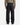A person stands facing away, wearing a light olive-green shirt and PROJEK RAW CANVAS BUNGEE LOOSE FIT CHINO PANTS featuring patch pockets on the back, paired with black shoes.