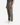 A person wearing PROJEK RAW KNIT CAVALRY TWILL RELAXED FIT CHINO PANTS and white sneakers stands against a white background, with only the lower half of their body visible.