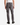 A person is shown from the back, standing against a simple white background, wearing a white tank top, black shoes, and PROJEK RAW’s CORDUROY 5-POCKET STRAIGHT FIT BARU PANTS.