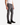 A person wearing a white tank top, PROJEK RAW CORDUROY 5-POCKET STRAIGHT FIT BARU PANTS, and black lace-up boots stands confidently against a plain white background.