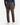 A person wearing PROJEK RAW CORDUROY RELAXED FIT CHINO PANTS, a navy long-sleeve shirt, and white sneakers, shown from the back against a plain white background.