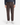 A person wearing PROJEK RAW CORDUROY RELAXED FIT CHINO PANTS, a dark long-sleeve shirt, and white sneakers stands facing forward. The image is cropped at the shoulders; hands are relaxed at the sides.