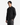 A man with straight black hair wears the PROJEK RAW CANVAS TWILL BUNGEE SHIRT featuring chest pockets, paired with dark cargo pants, standing with one hand in his pocket against a plain white background.