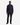 A man stands facing forward, wearing the PROJEK RAW TEXTURED KNIT CLASSIC FIT SHIRT— a versatile dark button-up—paired with black pants and black shoes against a plain white background.