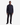 A man stands facing forward, wearing the PROJEK RAW TEXTURED KNIT CLASSIC FIT SHIRT in dark navy, paired with black pants and black shoes against a plain white background.