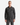 A man with short hair wears the PROJEK RAW RELAXED FIT DENIM SHIRT in dark gray, crafted from soft denim fabric with two chest pockets, styled with gray pants against a plain white background. This essential piece offers effortless comfort and timeless style.