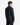 A person with short brown hair, dressed in the PROJEK RAW KNIT FLANNEL SHIRT in a classic cut dark blue and black pants, stands facing away and slightly to the side against a plain white background—a true wardrobe essential.