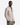 A man wearing the PROJEK RAW JACQUARD KNIT OVERSHIRT with chest pockets and olive green pants stands with his hands in his pockets, looking at the camera against a plain white background.