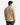 A man with black hair, dressed in the PROJEK RAW KNIT CAVALRY TWILL OVERSHIRT and blue jeans, stands facing away from the camera against a plain white background.