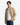 A man with black hair wears the PROJEK RAW KNIT CAVALRY TWILL OVERSHIRT in beige over a white ribbed sweater and blue jeans, standing against a plain white background with a neutral expression.