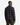 A man stands facing away, wearing the PROJEK RAW FLANNEL PLAID OVERSHIRT with a relaxed silhouette in black and gray, paired with brown pants against a plain white background.