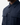 A person wearing the PROJEK RAW BUNGEE SOLID OVERSHIRT, a dark blue utility-inspired button-up with two front pockets, shown from the shoulders down against a plain light background.