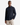 A man wearing the PROJEK RAW BUNGEE SOLID OVERSHIRT, a dark navy utility-inspired shirt featuring chest pockets and a snap-button front, paired with light beige cargo pants, stands against a plain white background.