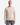 A man with a shaved head wears the PROJEK RAW CLASSIC FIT CHENILLE CREWNECK SWEATER in beige, paired with gray jeans. He stands against a plain white background, facing forward with a neutral expression. The plush chenille fabric of the sweater adds subtle texture to the look.