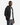 A man stands against a plain white background, looking at the camera with one hand in his pocket, wearing the PROJEK RAW BONDED CHENILLE ZIP-UP HOODIE in black over a white shirt and gray jeans—a cozy layer for any occasion.