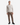 A man stands facing forward, wearing the PROJEK RAW HONEYCOMB CHENILLE SWEATER in light beige—a cozy essential for any casual wardrobe—paired with brown pants and black sneakers against a plain white background.