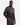 A man wearing the PROJEK RAW BONDED CHENILLE 1/4″ ZIP PULLOVER SWEATER—with its dark, patterned knit and horizontal stripes—pairs it with brown pants as he stands against a plain white background. The bonded chenille fabric of the pullover lends cozy texture and warmth to his stylish look.