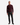 A man stands facing forward against a white background wearing a PROJEK RAW CLASSIC FIT JACQUARD KNIT PULLOVER 1/4″ ZIP SWEATER in burgundy, paired with black pants and black dress shoes.