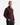 A man wears the PROJEK RAW CLASSIC FIT JACQUARD KNIT PULLOVER 1/4″ ZIP SWEATER in maroon with black pants, standing with one hand in his pocket against a plain white background.