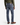 A man wearing the PROJEK RAW BARU CLASSIC STRAIGHT FIT DENIM, an olive green sweater, and brown dress shoes is photographed from the back against a white background.