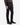 A person wearing the PROJEK RAW BARU CLASSIC COLORED KNIT DENIM jeans, paired with a brown ribbed sweater and black dress shoes, stands against a plain white background.
